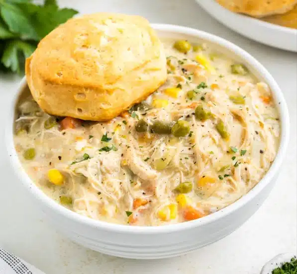 chicken pot pie bowl topped with biscuit