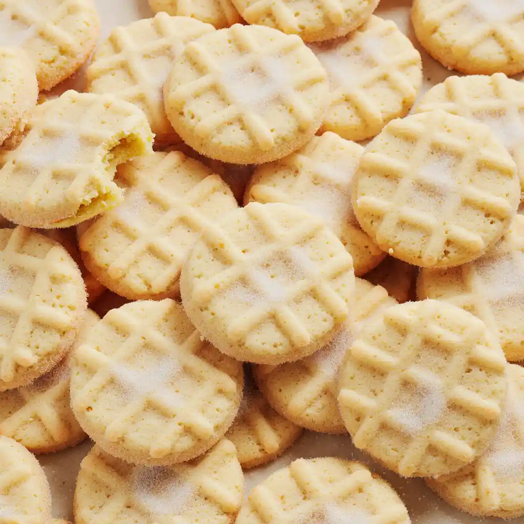 Five types of mini sugar cookies on marble