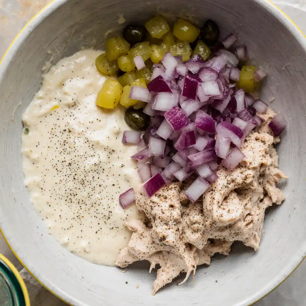 Ingredients for Dill Pickle Chicken Salad on white marble