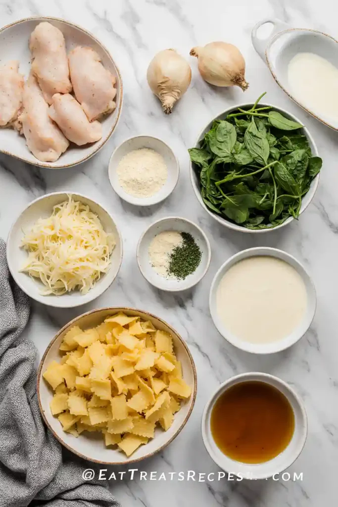 Ingredients for creamy white lasagna soup on marble surface