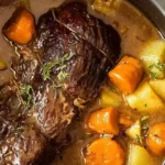 Slow-Cooker Beef Roast Crockpot with tender beef, potatoes, carrots, and gravy