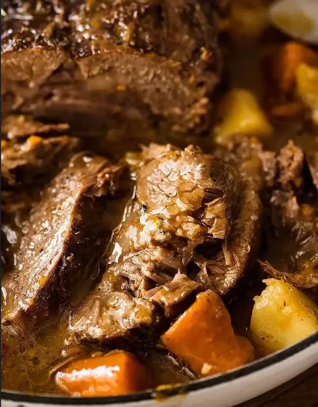 Slow-cooker pot roast with tender beef, potatoes, carrots, and savory gravy
