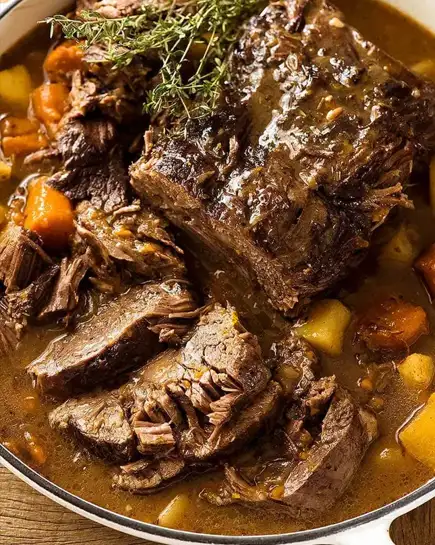 Slow-cooker pot roast with tender beef, potatoes, carrots, and savory gravy