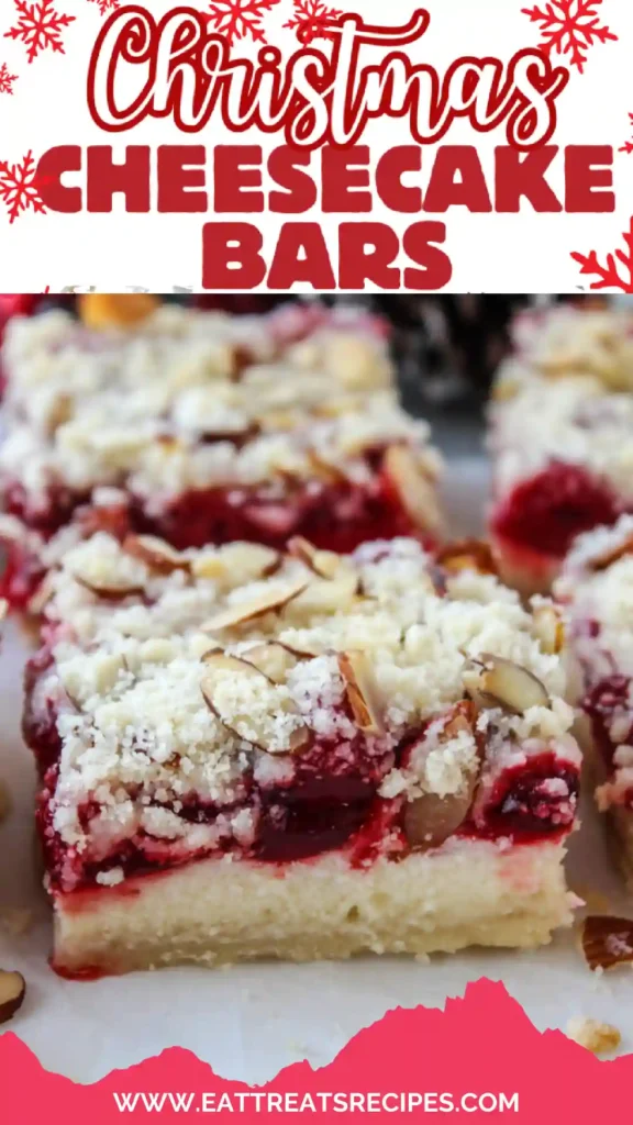 Modern Christmas cheesecake bars with vibrant cranberry swirl on white marble