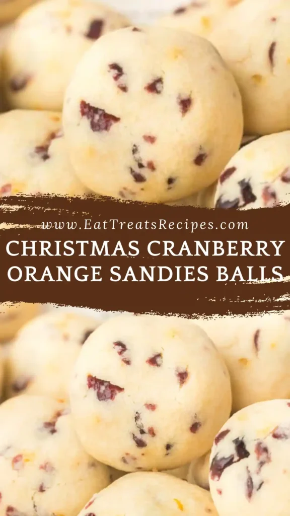 Christmas cranberry orange sandies balls on white marble