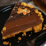 Christmas gingerbread chocolate tart with glossy ganache on white marble