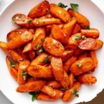 Christmas glazed carrots side dish on white marble