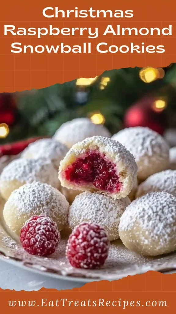 Christmas Raspberry Almond Snowball Cookies with raspberry filling and powdered sugar