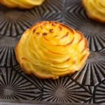 Duchess potatoes for Christmas and Thanksgiving served golden and piped