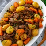 Melt-in-your-mouth crock pot chuck roast with carrots and potatoes