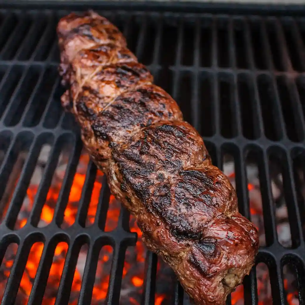 Quick Christmas stuffed beef tenderloin sliced with festive herb butter filling
