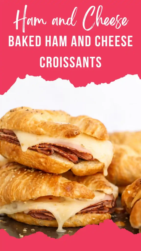 Baked ham and cheese croissants fresh from the oven, flaky and golden on a white marble surface