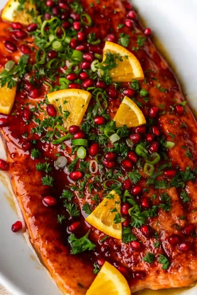 Christmas salmon with pomegranate glaze on white marble