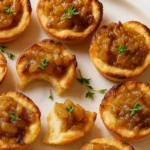 French Onion Soup Bites with melted cheese on golden pastry