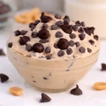 Greek Yogurt Cookie Dough served in a bowl with chocolate chips on white marble