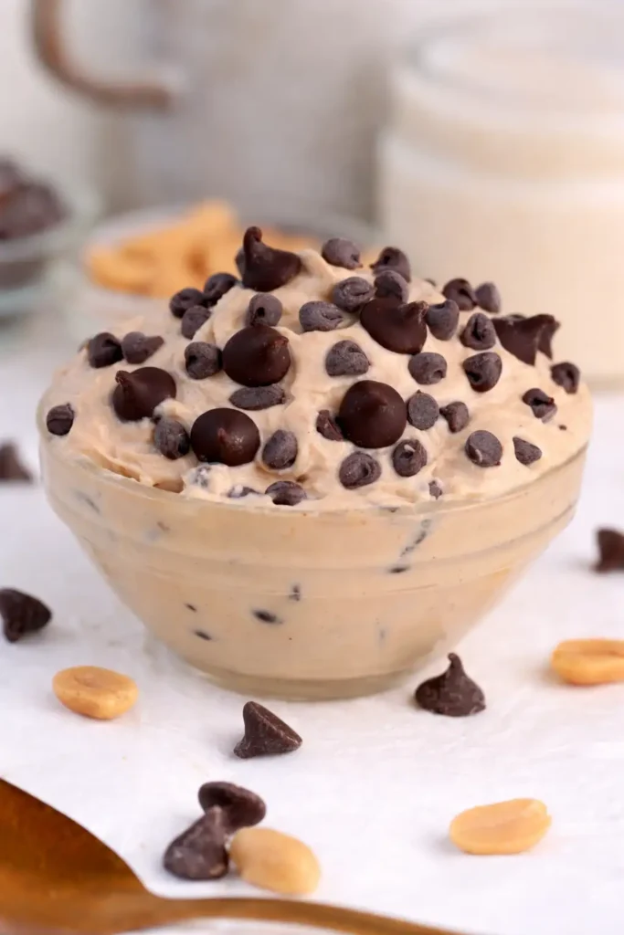 Greek Yogurt Cookie Dough served in a bowl with chocolate chips on white marble