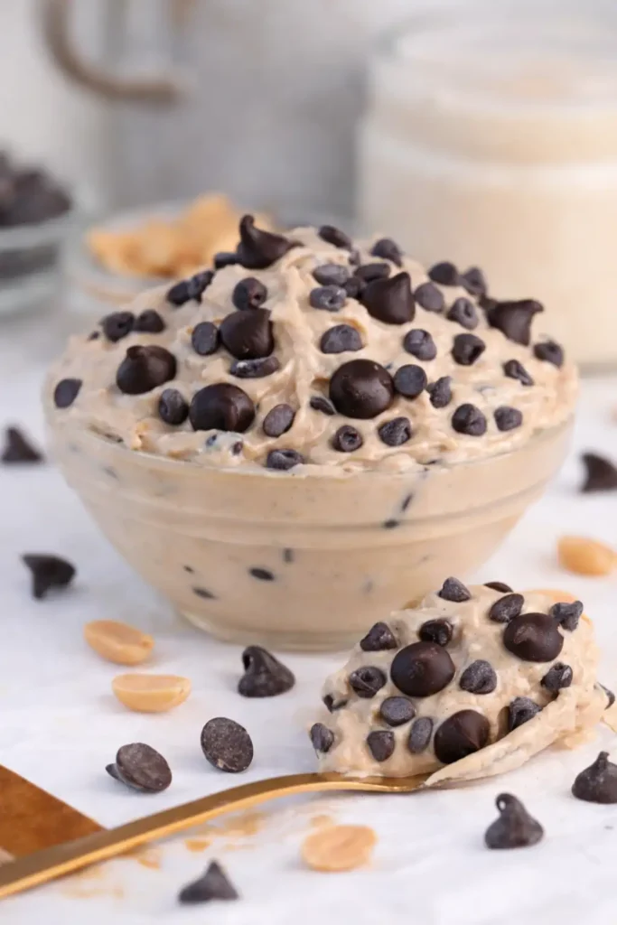 Greek Yogurt Cookie Dough served in a bowl with chocolate chips on white marble