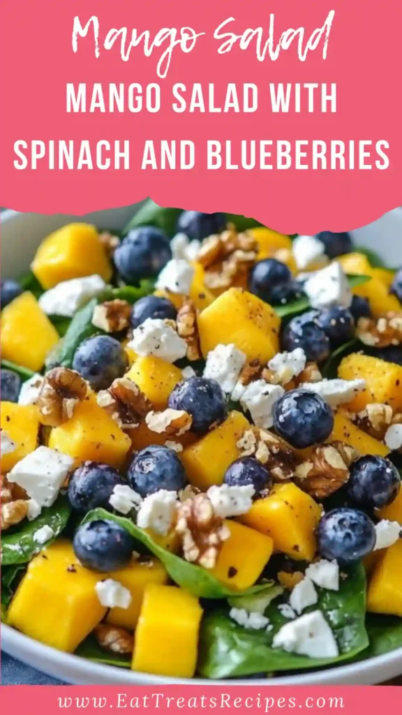 Mango salad with spinach and blueberries in a cozy serving bowl