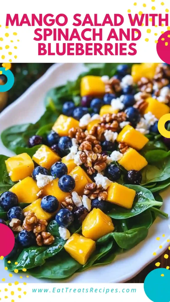 Mango salad with spinach and blueberries in a cozy serving bowl