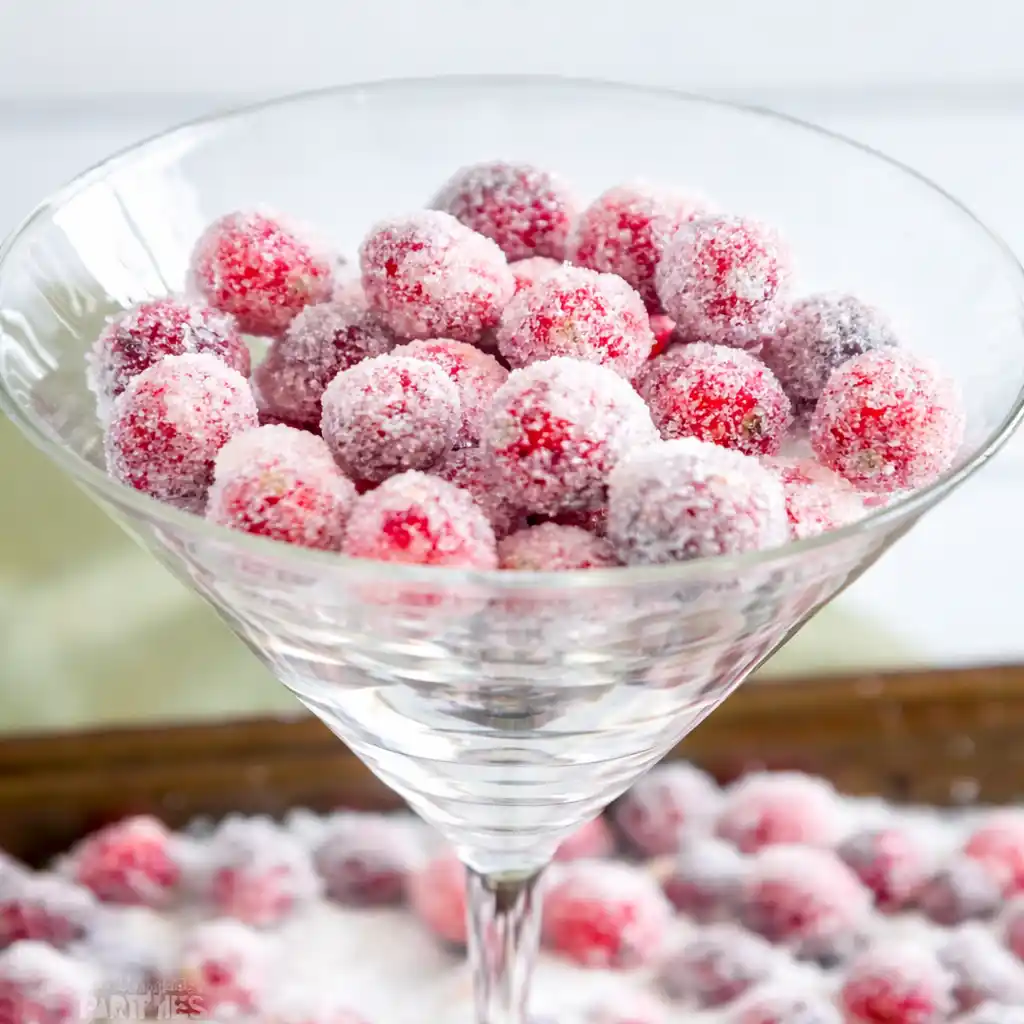 Orange vanilla candied cranberries sparkling with sugar for holiday desserts