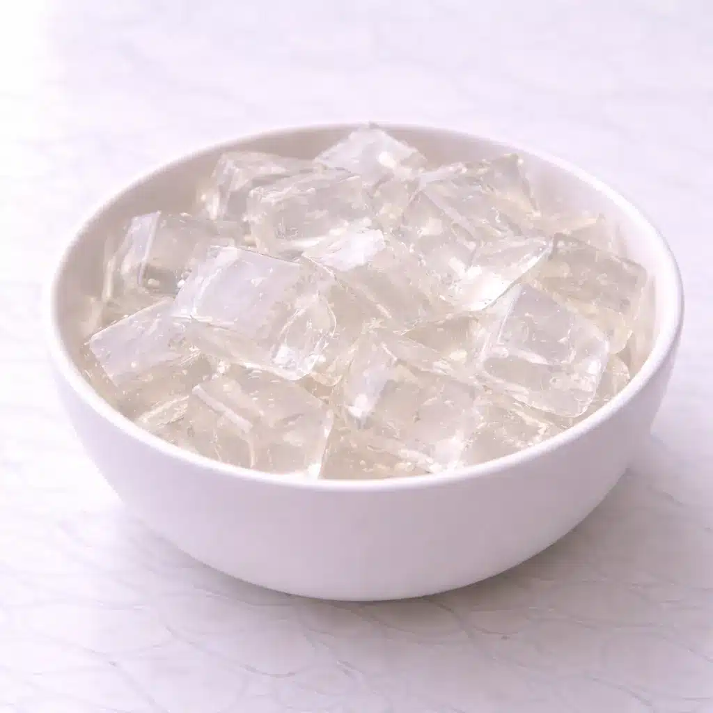Gelatin Drink Recipe in clear glass mug on white marble surface, simple 3 ingredient gelatin trick drink