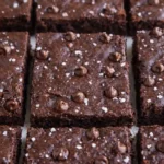 Serving healthy sweet potato brownies on white plate with clean presentation