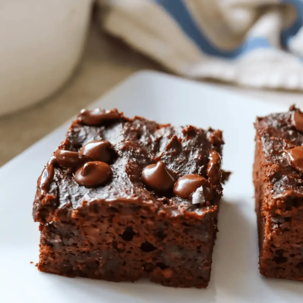 Serving healthy sweet potato brownies on white plate with clean presentation