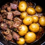 slow cooker garlic butter beef bites stored in airtight container for meal prep