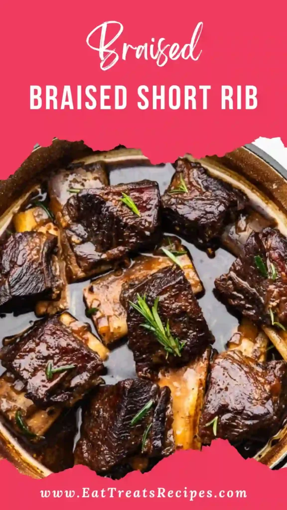 Raw beef short ribs with carrots, garlic, herbs, and wine on marble surface