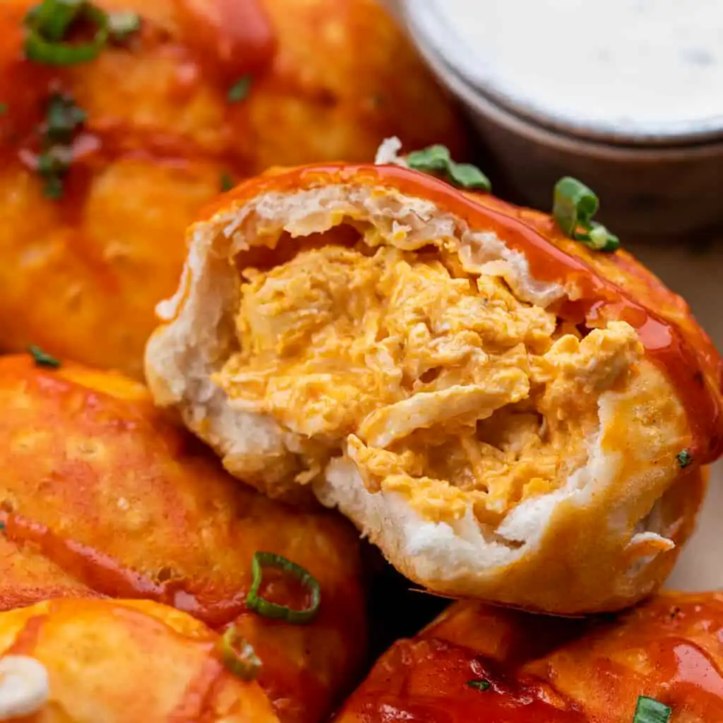 buffalo ranch chicken bombs stored in meal prep container on marble surface