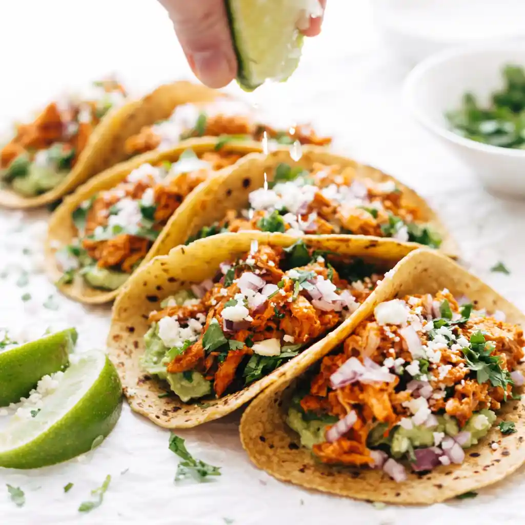 chicken tinga taco filling stored in airtight container for meal prep