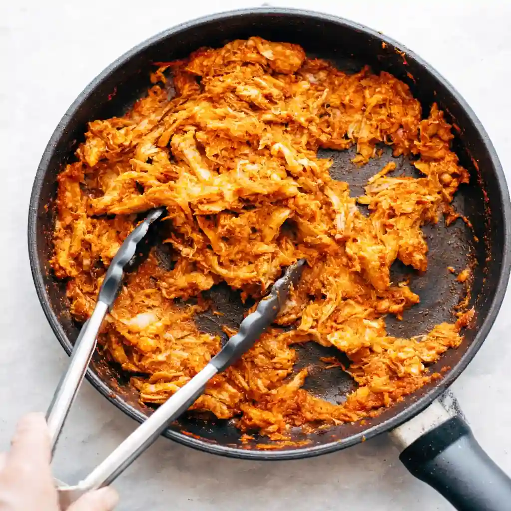 chicken tinga taco filling stored in airtight container for meal prep
