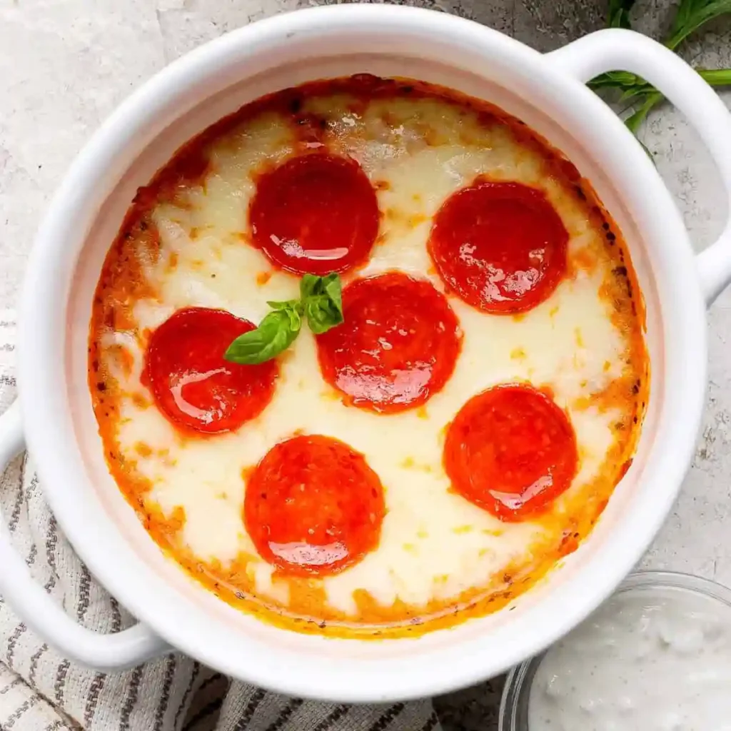 cottage cheese pizza bowl stored in glass meal prep container