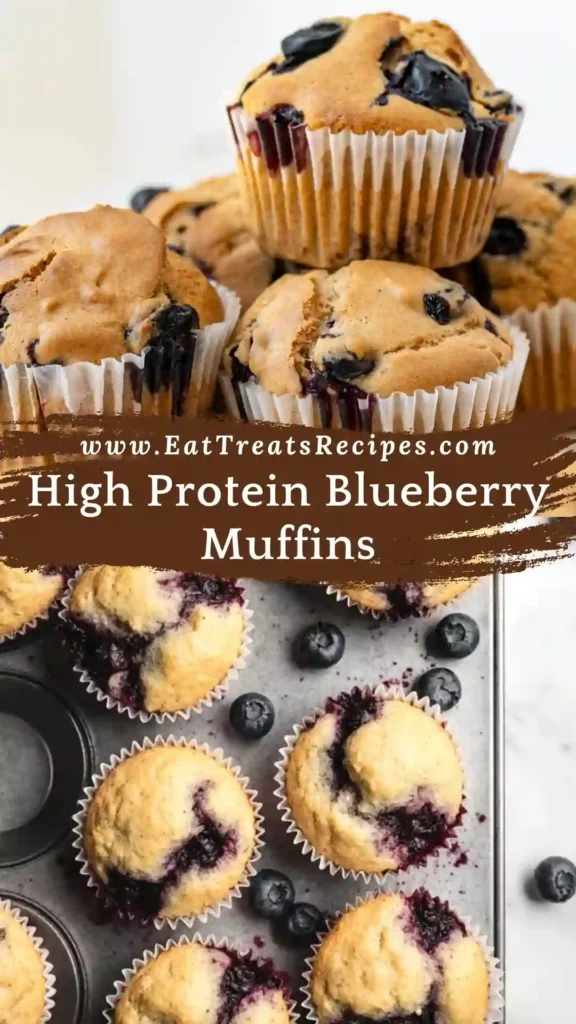 Serving high protein blueberry muffins on white plate with fresh blueberries