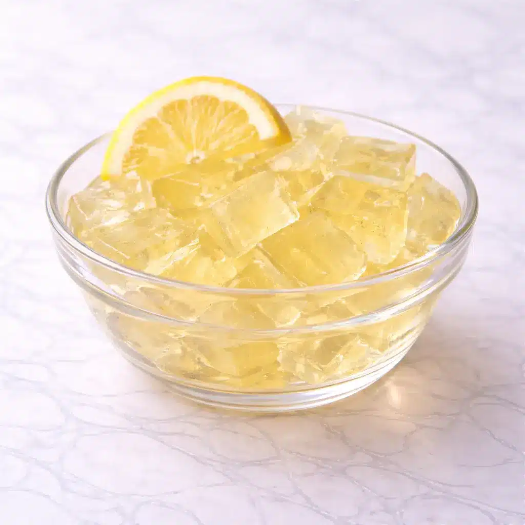 Kelly Clarkson Jello Recipe served in clear glass bowl on white marble background