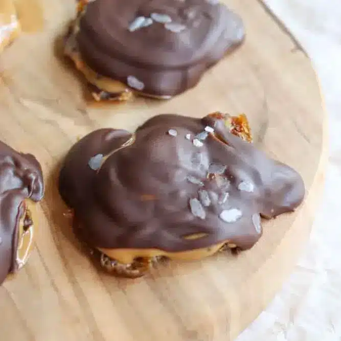 finished smashed date snickers bars served on marble background