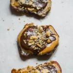 finished smashed date snickers bars served on marble background