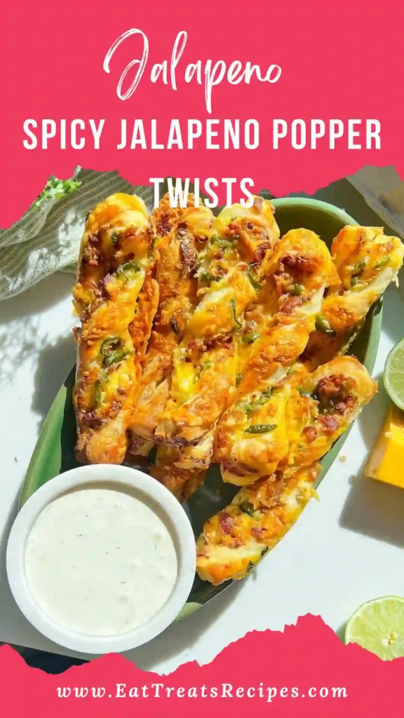 Close-up of flaky layers and creamy jalapeno cheese filling inside popper twists