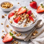 strawberry crackle salad served as holiday dessert next to christmas crackers and fruit salads