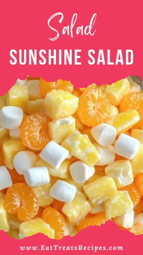 Sunshine Salad with mandarin oranges, pineapple and marshmallows in white bowl on marble surface