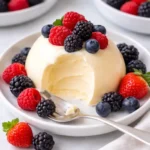 Bavarian cream and berries dessert in glass bowl