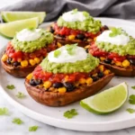 loaded black bean taco sweet potatoes with avocado and toppings