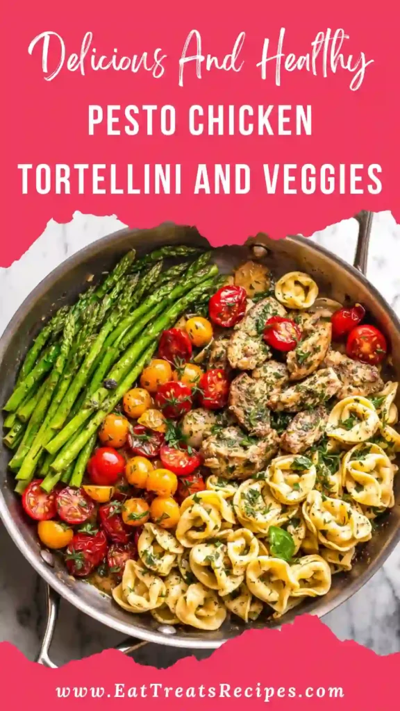 Pesto chicken tortellini and veggies served in skillet with basil pesto sauce and colorful vegetables